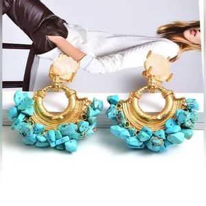 These are unique peices of Gold plated earrings with coral beads.